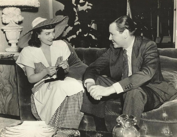 Joan Crawford talking to Herbert Marshall on the set of 'When Ladies Meet' (1941)